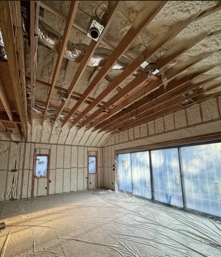 Interior walls and ceiling insulated with spray foam during new construction in Bartlett